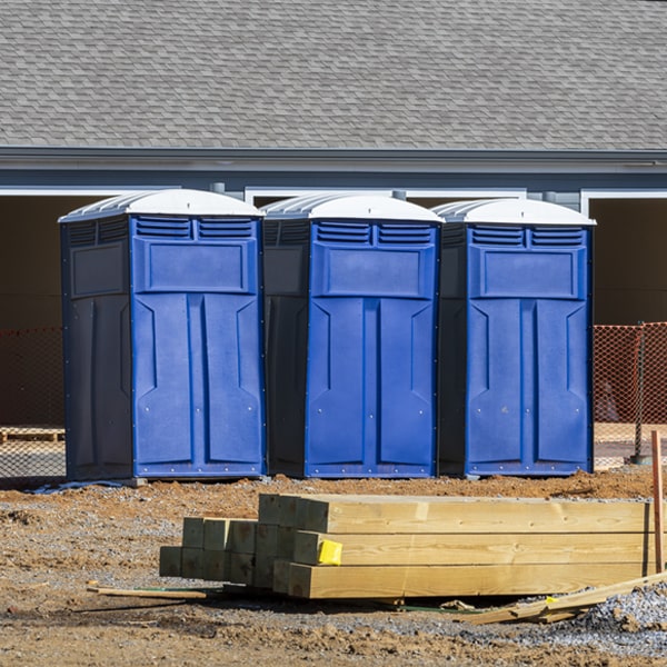 what is the cost difference between standard and deluxe portable restroom rentals in Omar